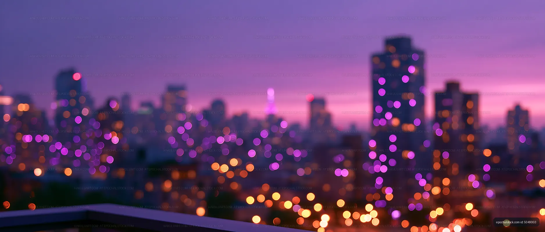 City skyline at dusk with purple lights