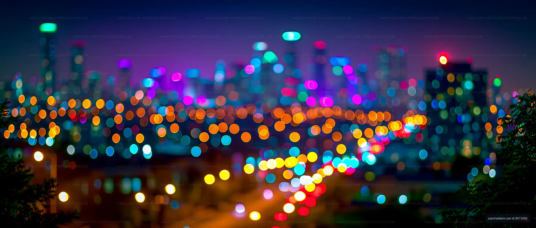 City skyline at night with colorful lights and blurred view