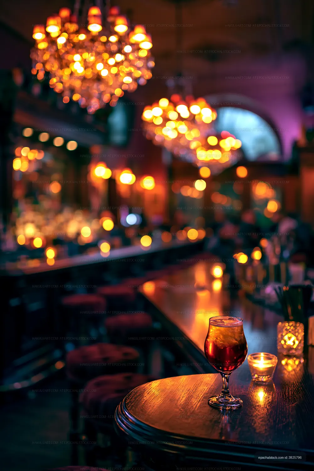 Drink on a bar table in dimly lit pub with chandeliers