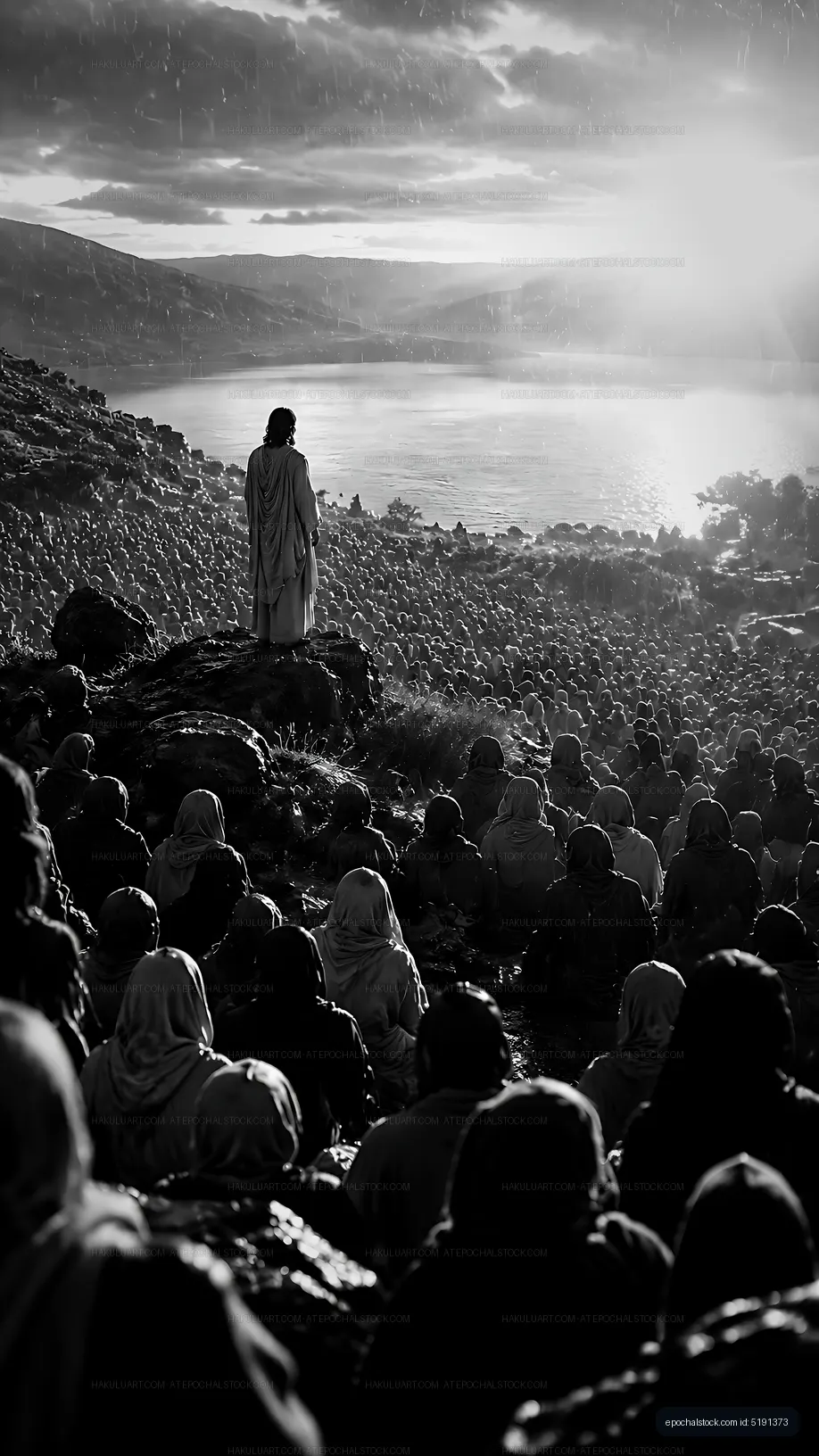 Crowd listening to a speaker by the water during a rainstorm