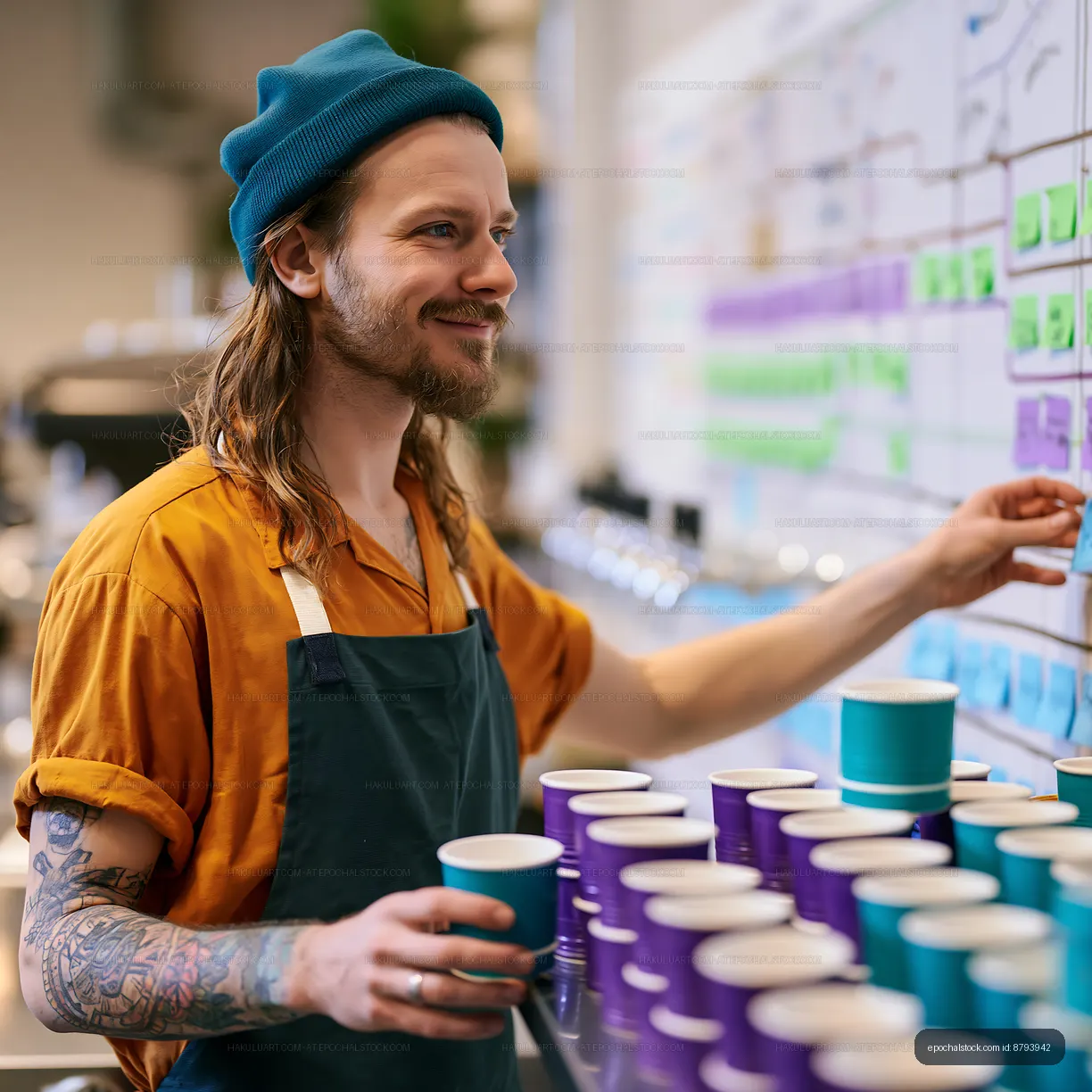 Barista preparing coffee drinks in a modern café