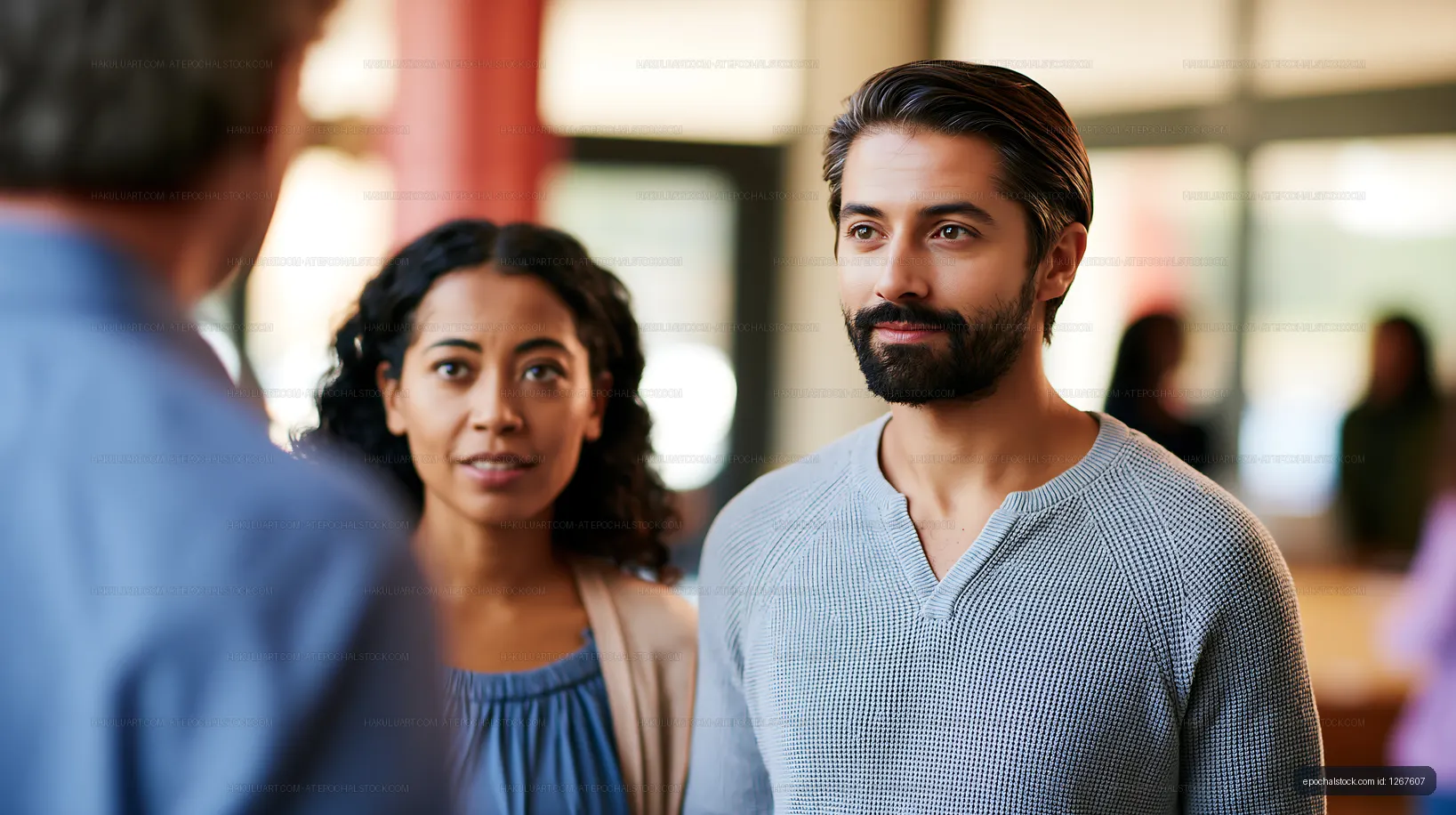 Couple engaging in conversation at community gathering indoors