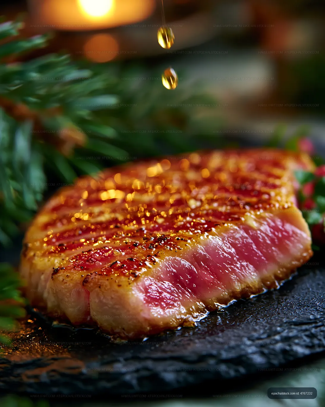 Grilled steak with seasoning on a black stone plate