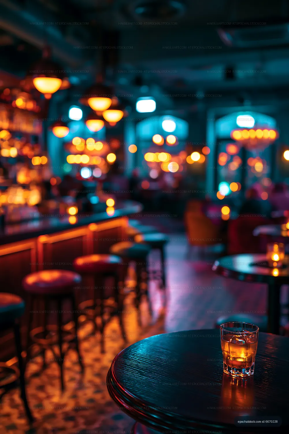 Bar scene with a drink on a table at night
