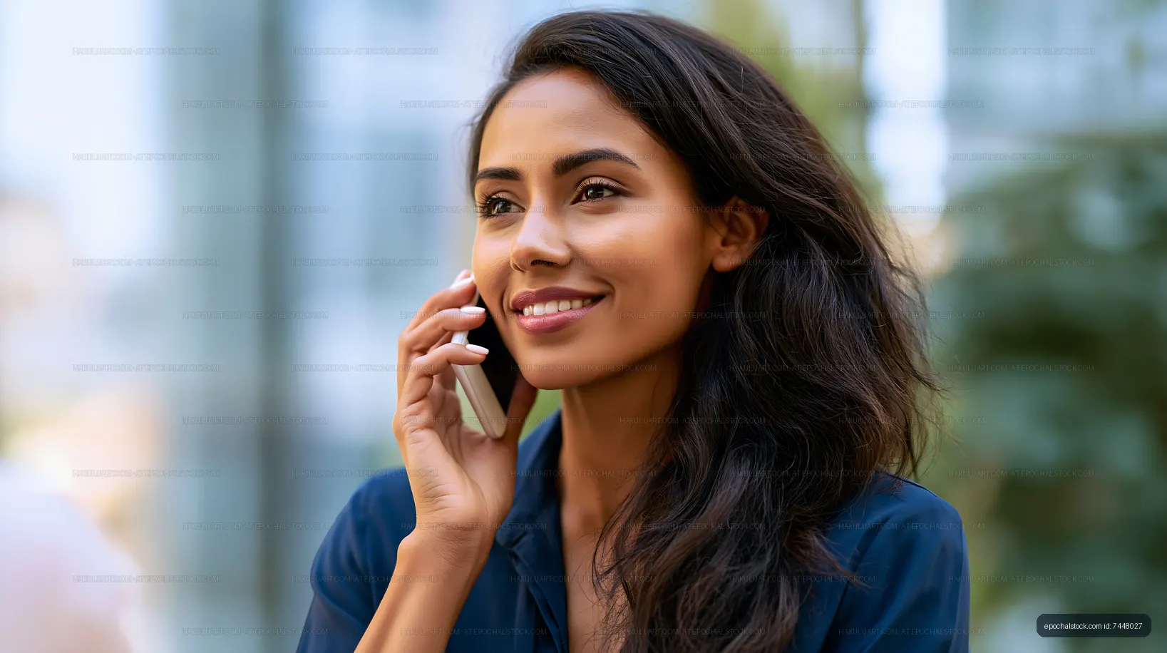 Woman talking on a mobile phone outdoors in a bright area