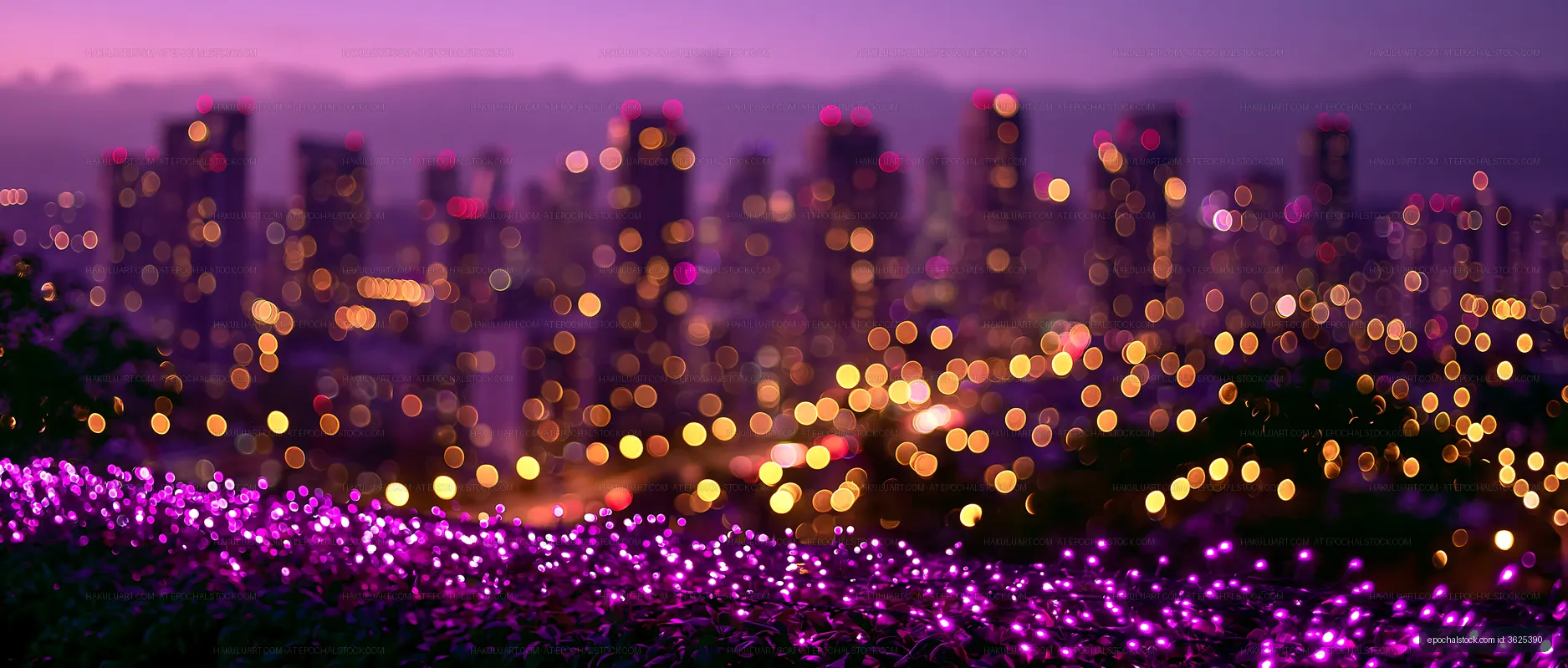 City skyline with blurred lights and flowers at dusk