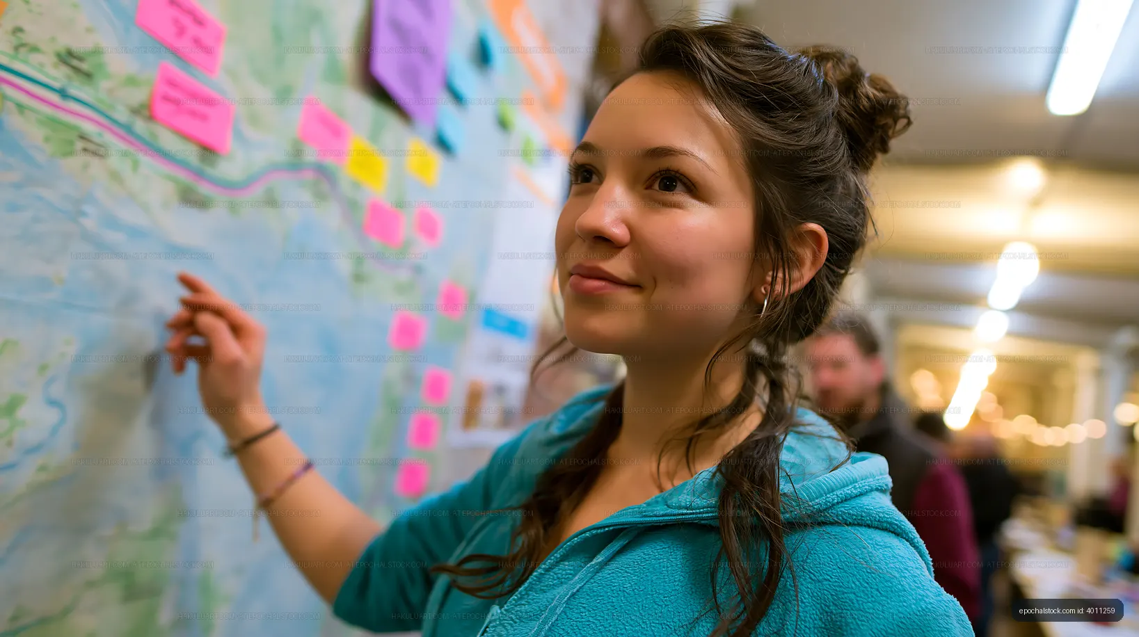Woman engaging with a map at a community event