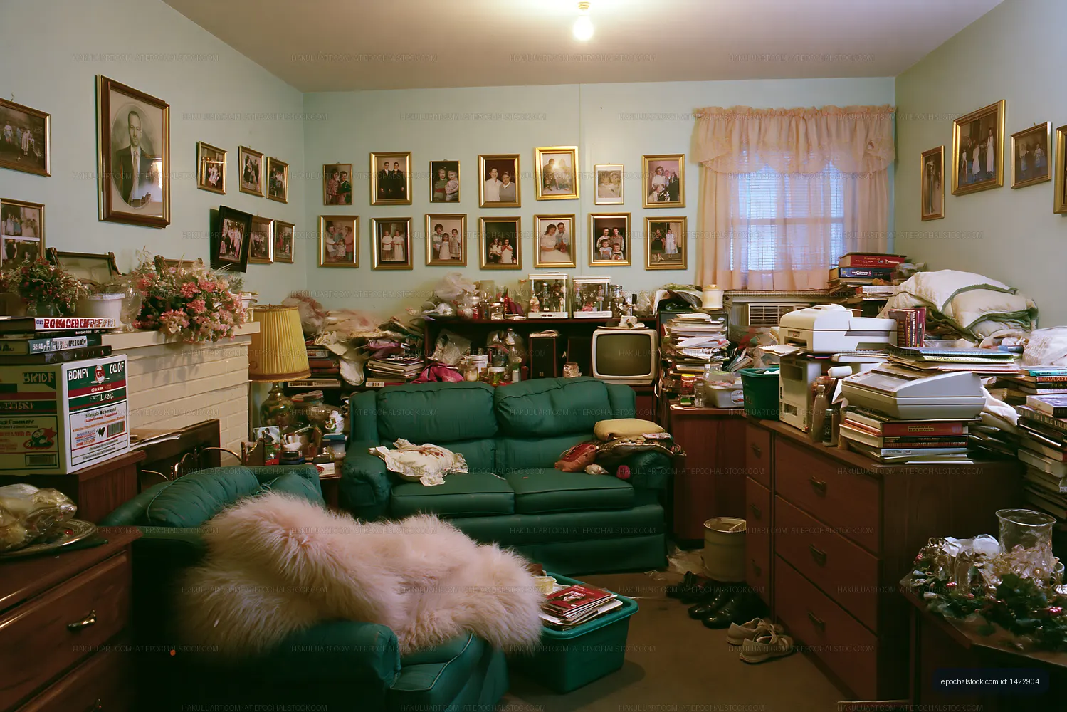 Cluttered room with old furniture and family photos on walls
