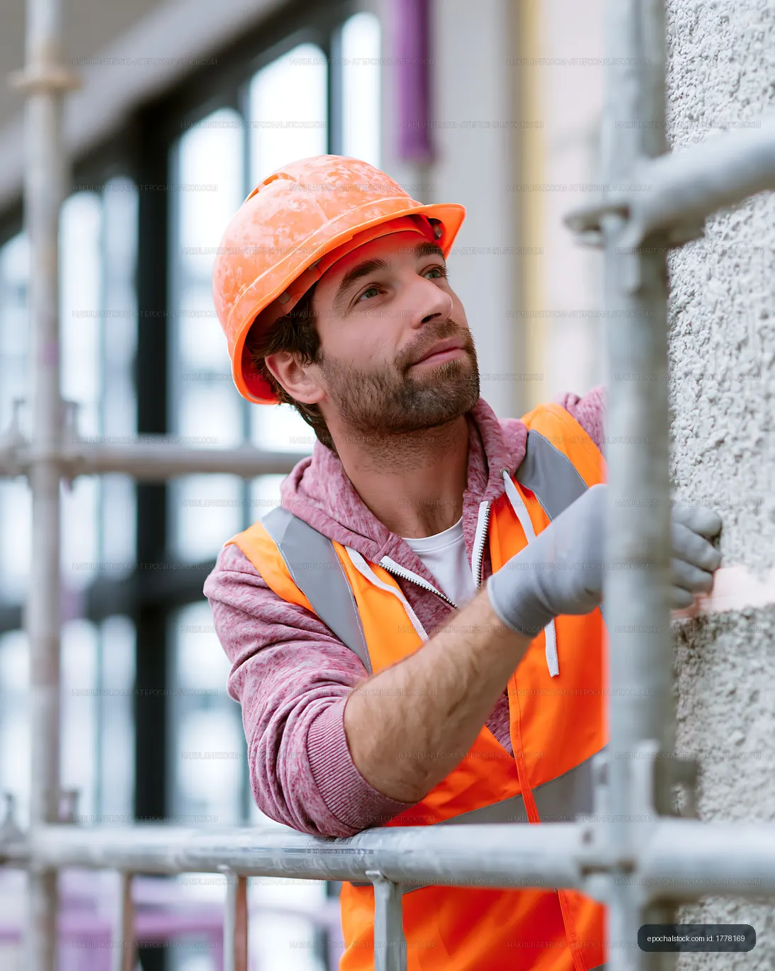 Construction worker with hard hat at building site