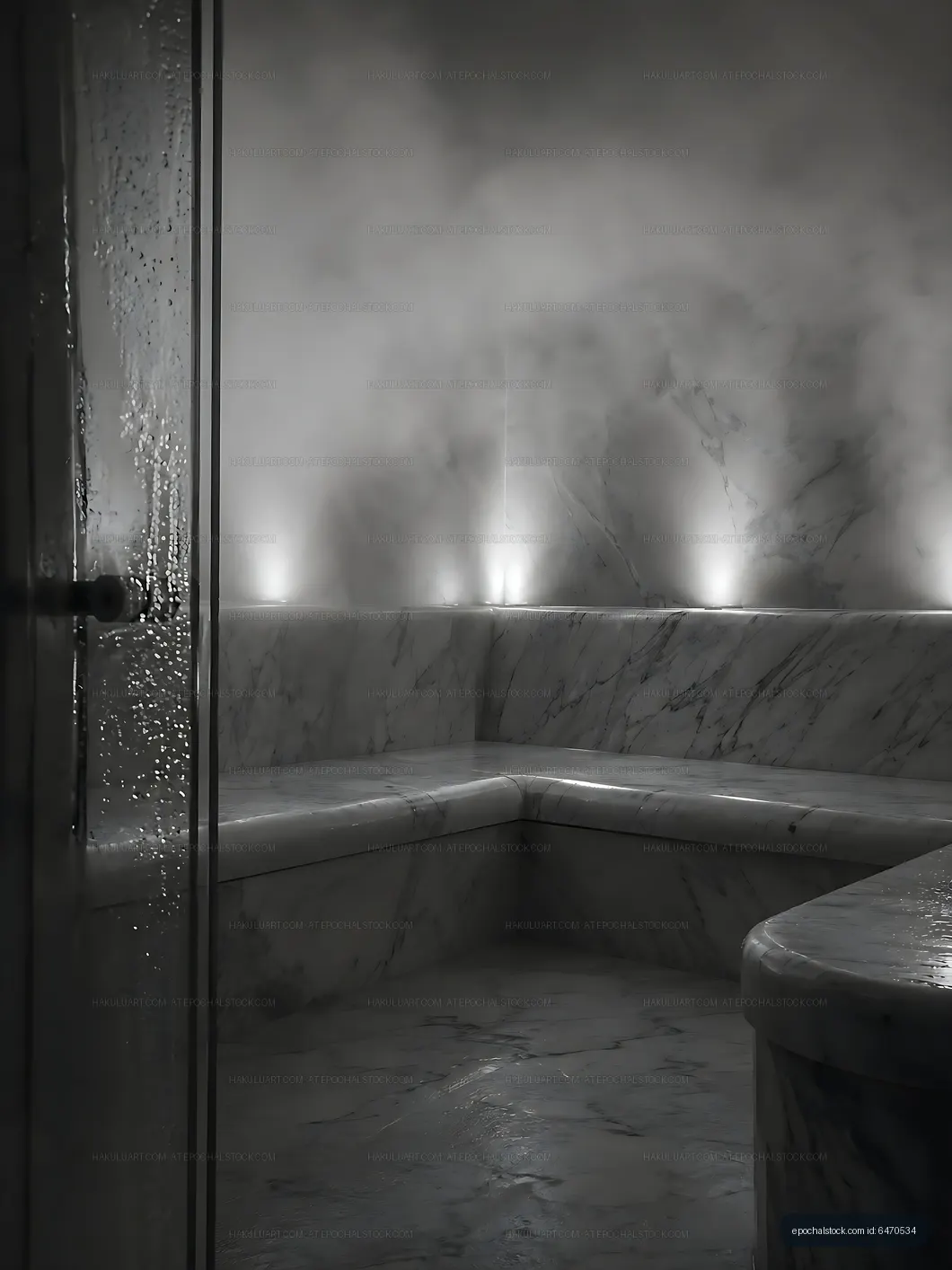 Steam fills a marble sauna with soft lighting at a wellness center
