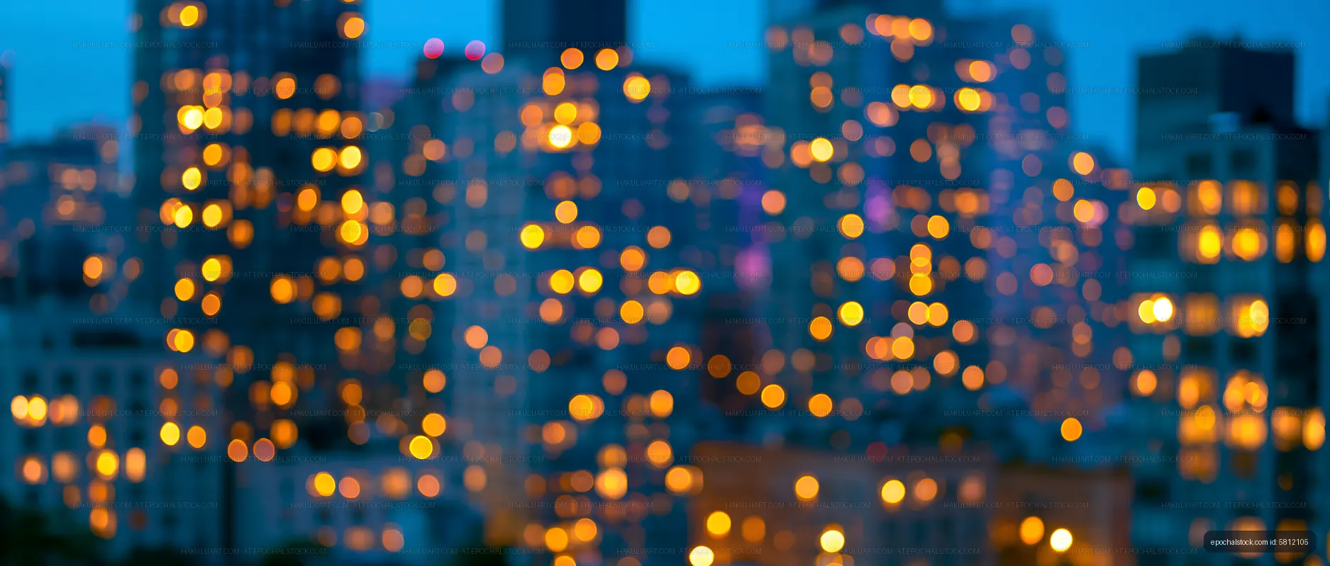 City skyline at night with blurred lights