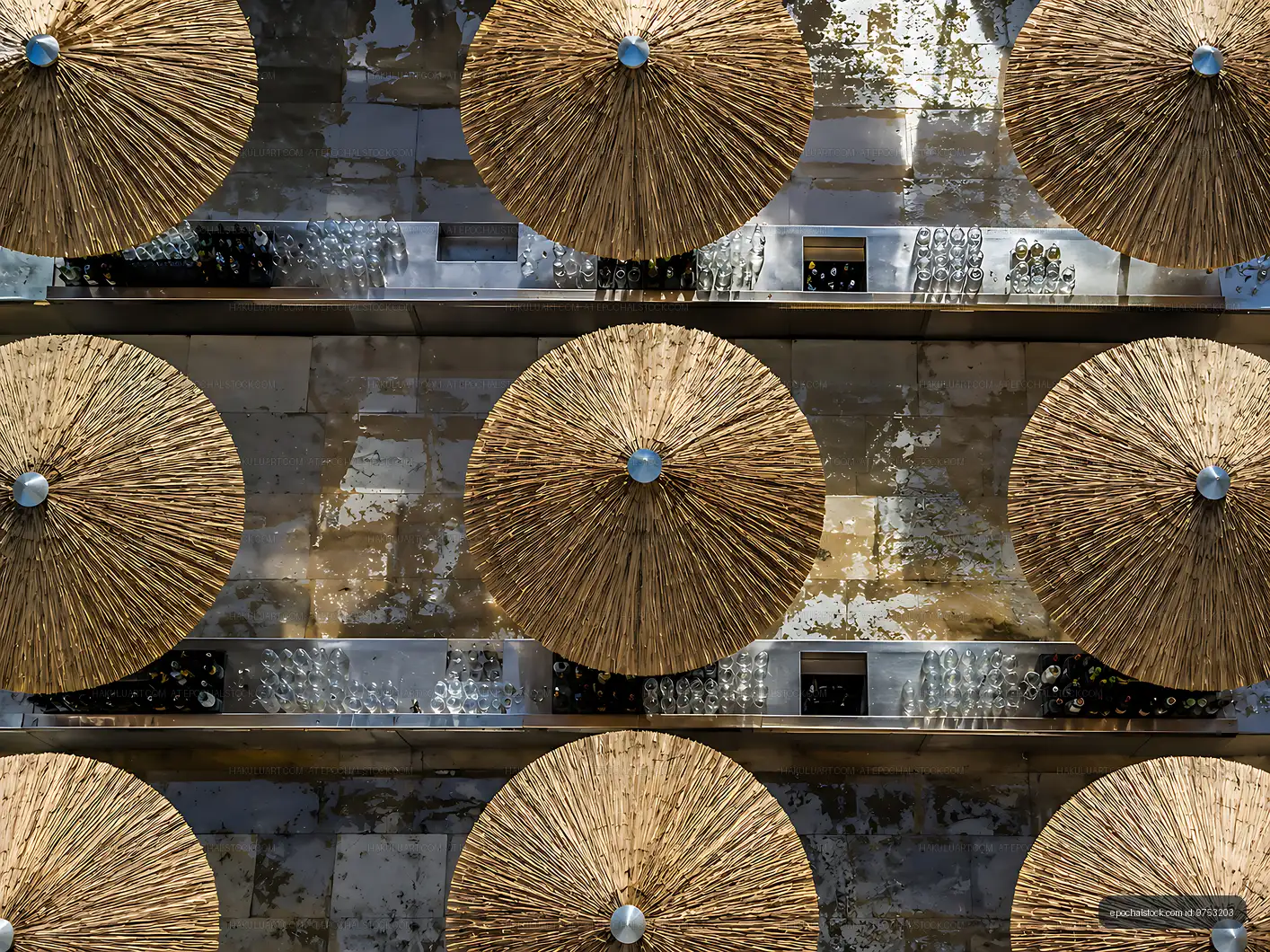 Straw umbrellas arranged on a bar counter