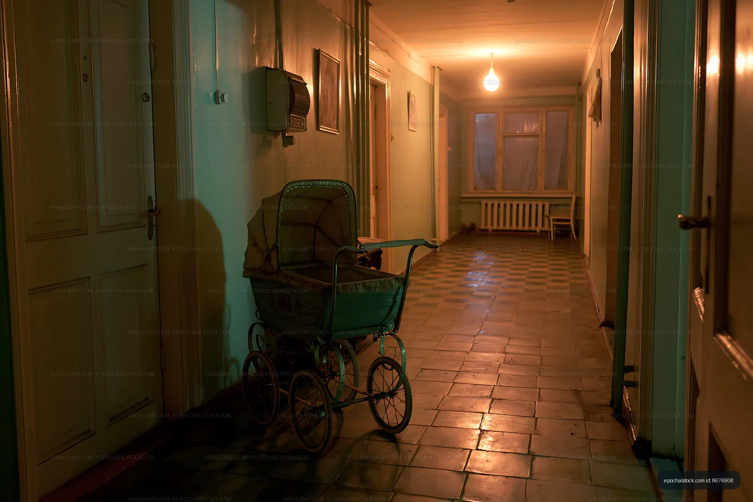 Old hallway with vintage baby stroller in low light