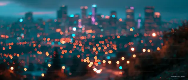 City skyline at night with blurred lights