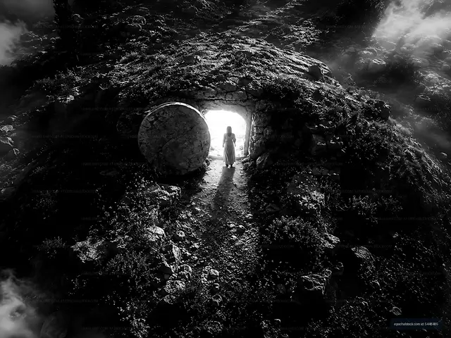 Woman standing at the entrance of a cave on a rocky terrain
