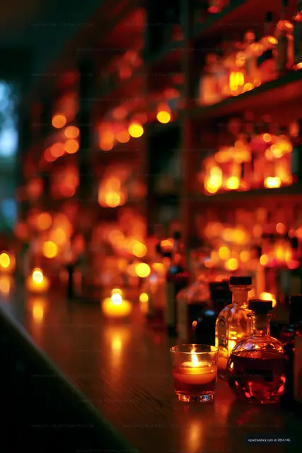 Warm glow of spirits on a wooden bar countertop