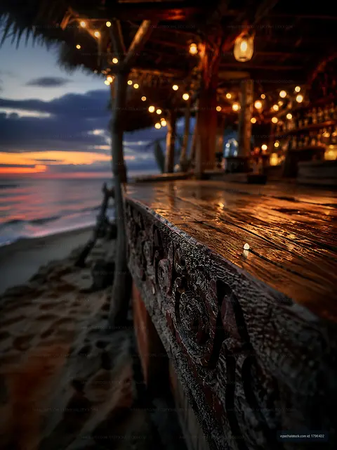 Wooden bar at beachside restaurant during sunset